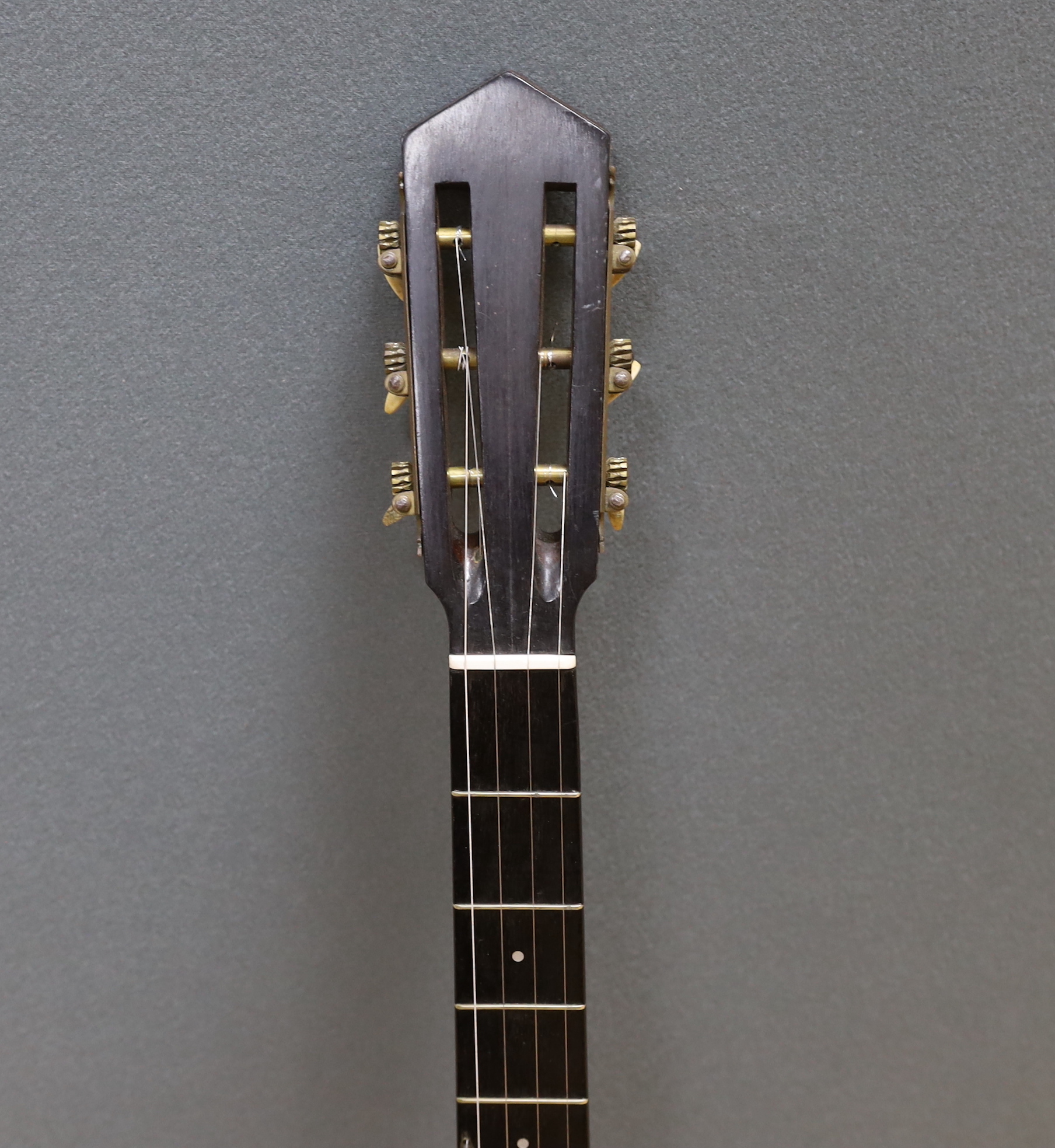 A six string banjo, unmarked, in a hard case by Ashbury
